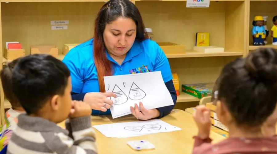 Little Thinkers ABC teacher leading a small group lesson at a classroom table